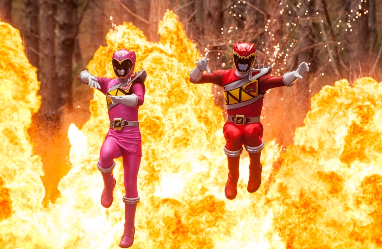 Power Rangers jumping in front of fire explosion