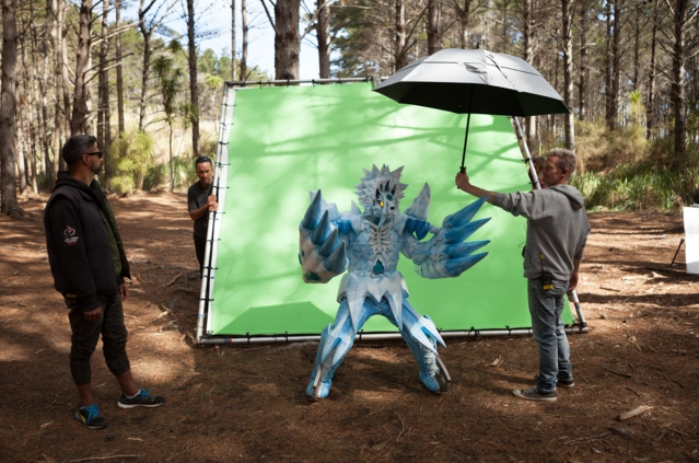 Filming Power Rangers character in front of green screen in the forest